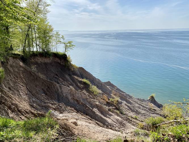 Light-colored rock slopes of Chimney Bluffs and Lake Ontario