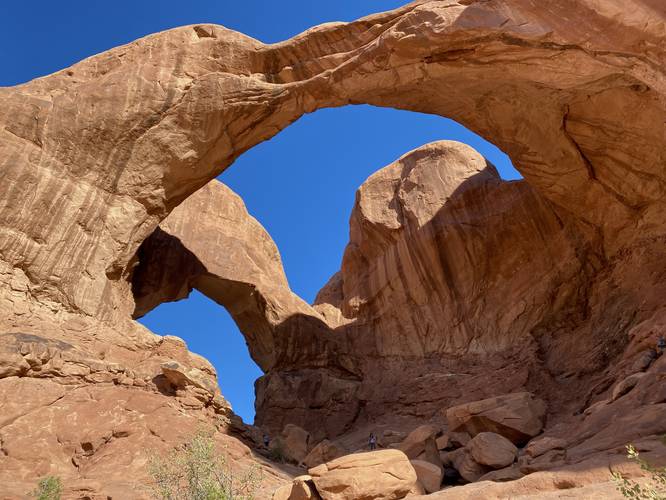 Hikers under Double Arch