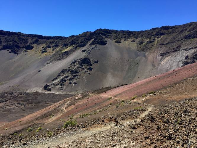 Beautiful shades of red, pink, green, and yellow mixed into the volcanic dirt