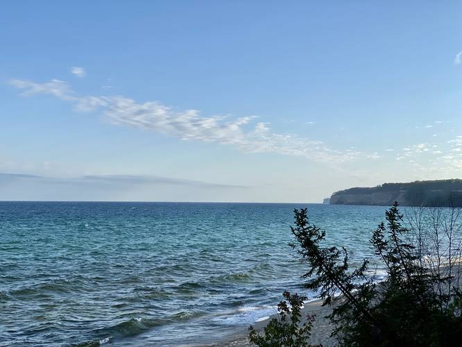 Turquiose waters of the Pictured Rocks National Lakeshore of Lake Superior from the North Country Trail - Cliffs in the distance