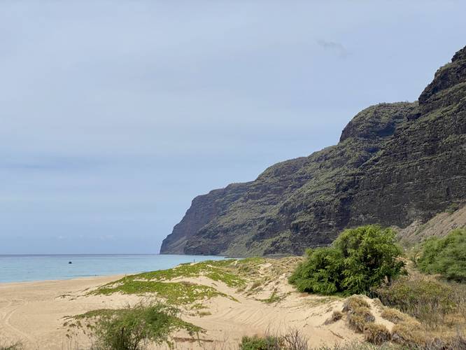View of the beach, sand dunes, and southern Na Pali coastal cliffs at Polihale State Park
