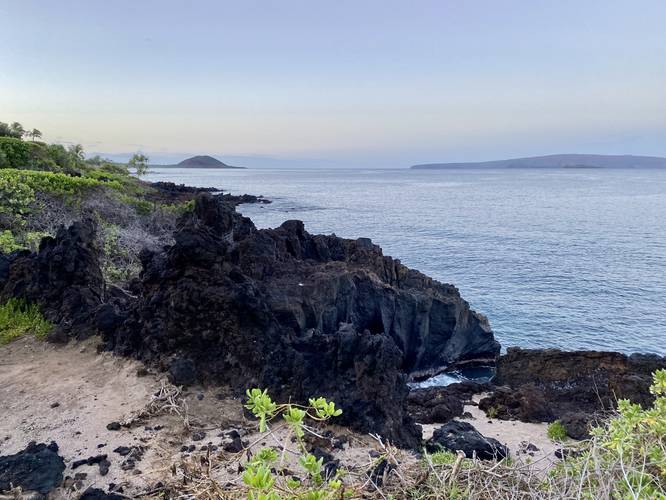 View of Pu'u Olia cinder cone and the island of Kaho'olawe from the Wailea Beach Path at sunrise